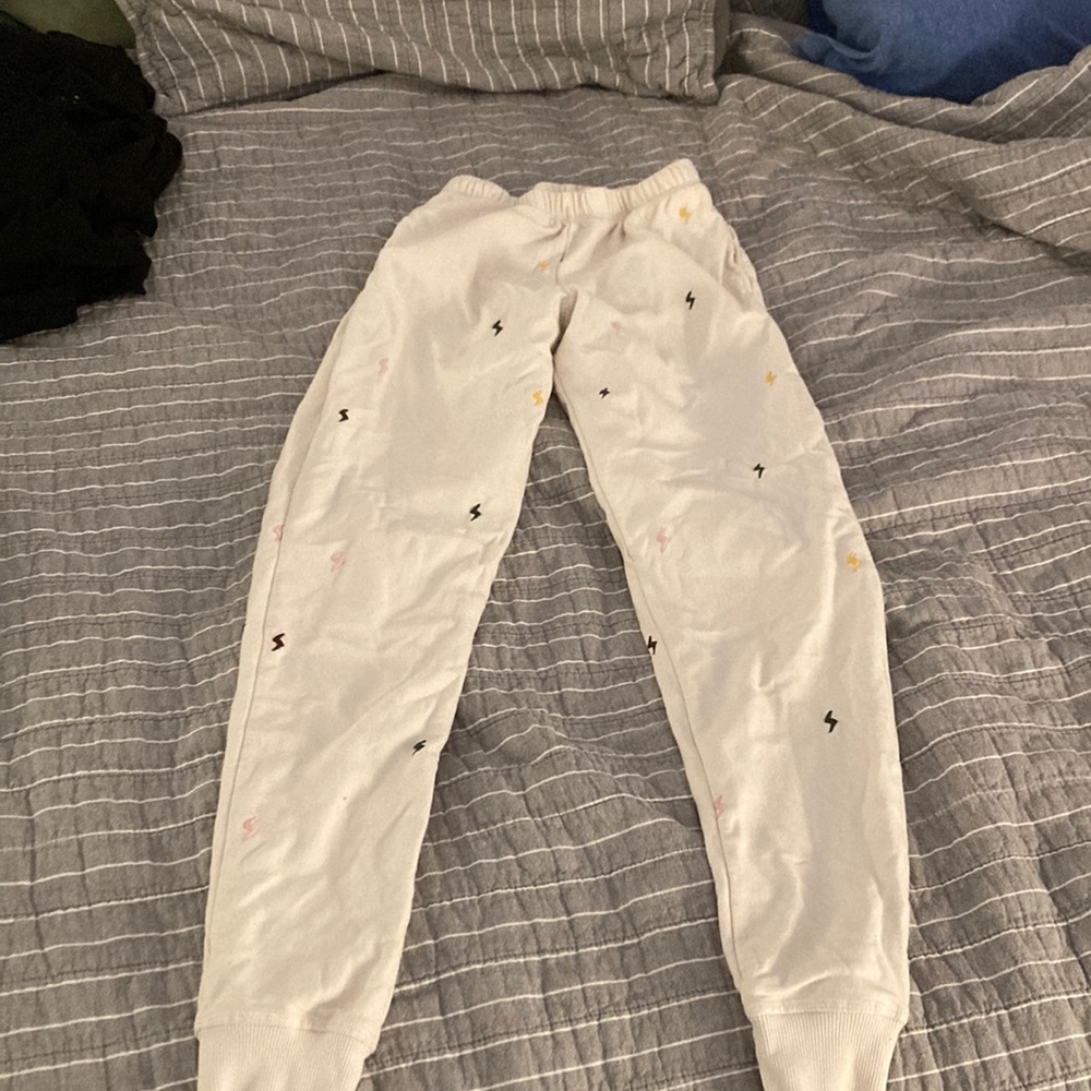White sweatpants with a design